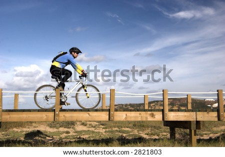 Man riding a bike in a beautiful day