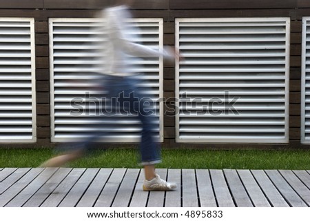 A motion blur abstract of a person walking in a hurry