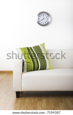 Nice home with a beautiful couch and a green pillow