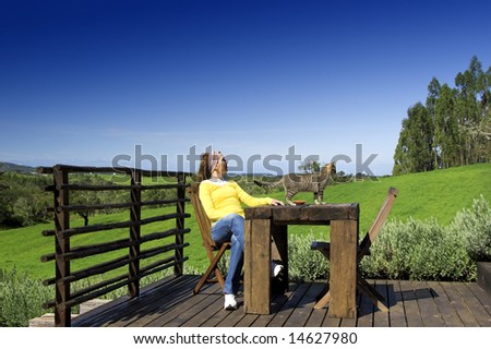 Young woman enjoying the nature with a small friend as company