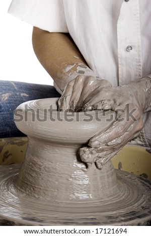 Close-up picture of a potter works a potter\'s wheel