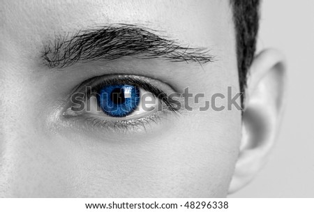Close-up portrait of a young man with blue eyes - OBS: model use lens contact