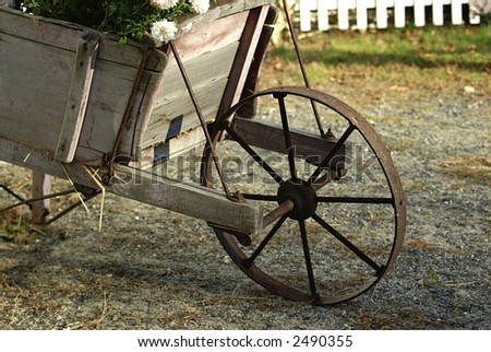 a vintage wood cart filled with flowers used as a display