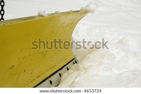a macro of a blade on a snow plow truck