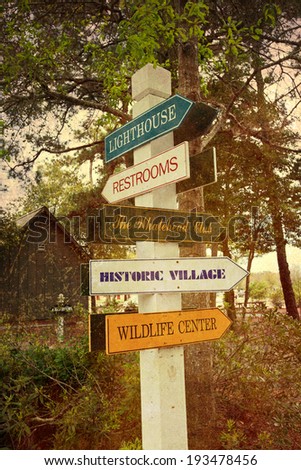 Tourist sign in Corolla in the Outer Banks with a vintage texture overlay
