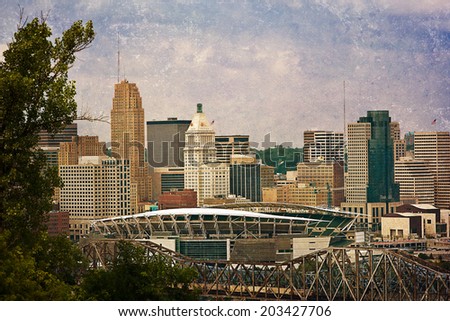 Downtown Cincinnati with the football stadium in the foreground.  This image has been treated with a texture overlay.