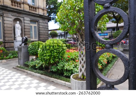 Behind the iron gate is the garden pathway into the National Theater in San Jose, Costa Rica.