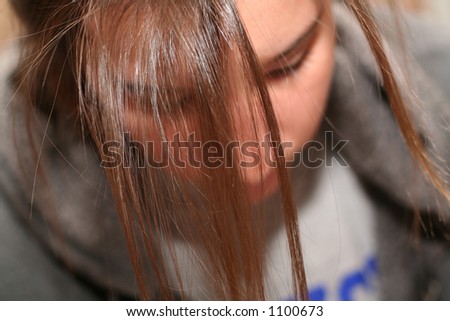 College student working with hair in face