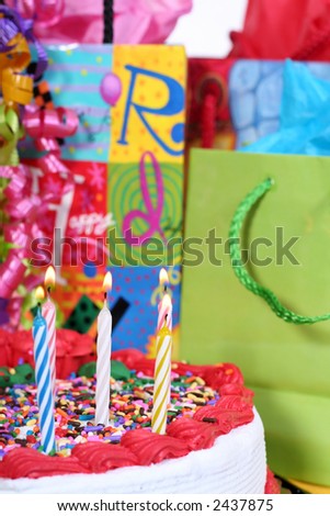 birthday cake with candles and presents