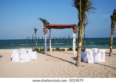 stock photo Romantic set up for a small wedding on the beach with the 