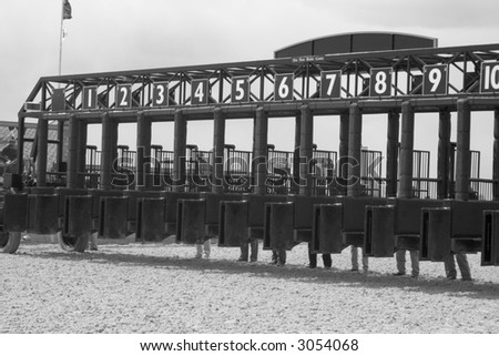 Race track starting gates in black and white...getting ready for the horses to enter
