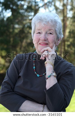 Smiling senior woman outside  with turquoise jewelry