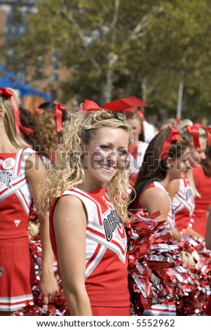 Ohio State Cheerleader smiling for the fans