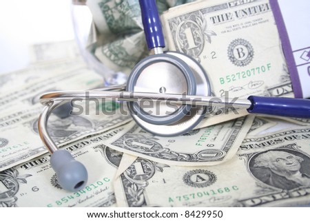 Stethoscope on money depicting the high cost of medical care