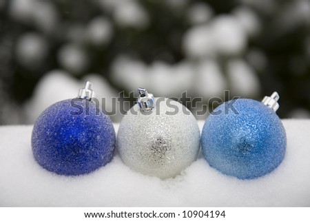 Blue ornaments in the snow