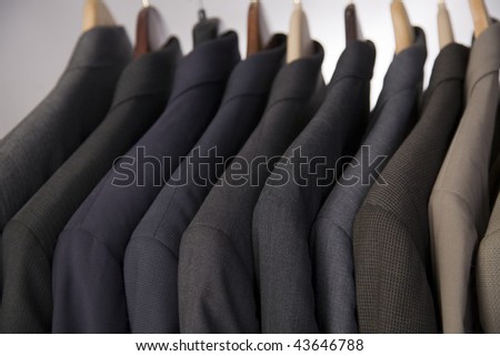Men's suits hanging on a rack