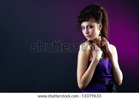 The portrait of a beautiful lady wearing a lilac dress