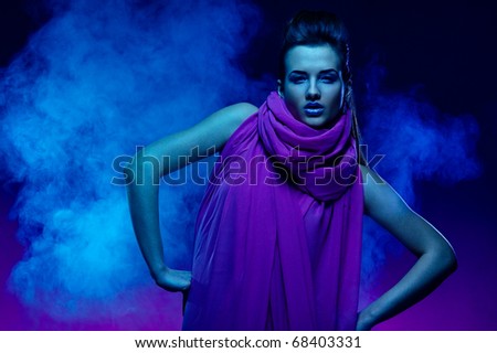 Portrait of the beautiful girl in dark tones