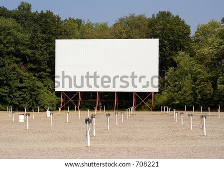 Drive in movie theater screen and speakers. Put your message on the screen!