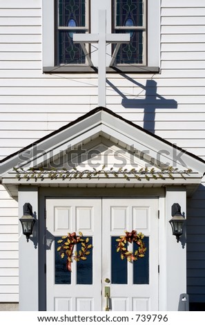 The front doors of a church, welcoming worshippers in.