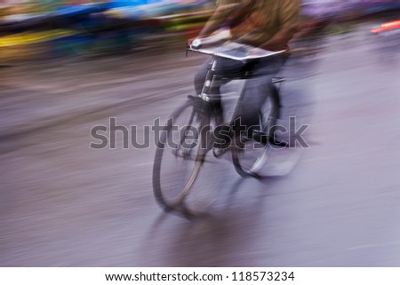 motion blur abstract of a bike rider in the street