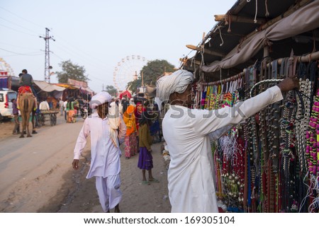 PUSHKAR, INDIA - NOVEMBER 15: Unidentified people shopping during traditional camel mela in Pushkar on November15 ,2013 in Pushkar, Rajasthan, India
