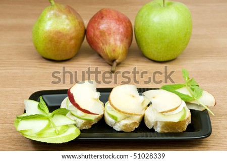 delicious canapes with french cheese and fruits