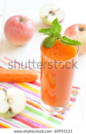 Fresh apple and carrot juice with mint