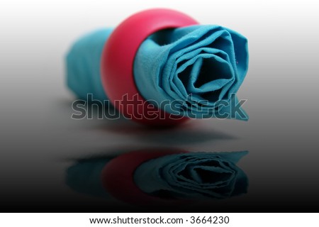 Blue napkin with pink ring in white gradient background