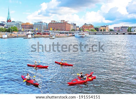 STOCKHOLM, SWEDEN - AUGUST 12, 2013: Unknown people are boating in kayaks in Stockholm, Sweden