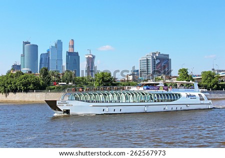 MOSCOW, RUSSIA - JUNE 05, 2013: View of Moscow river, pleasure boat and Moscow International Business Center (Moscow City), Russia