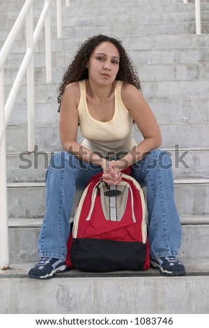 Young Latina Student with backpack on stairs
