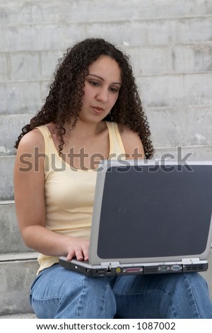 Young Latina Student with Computer