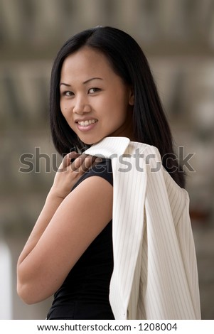 Asian Business Woman Looking Over Left Shoulder