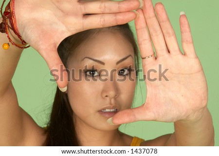 Young Asian Woman Framing Picture with her Hands