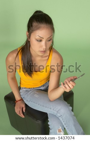Young Woman Looking at Cell Phone