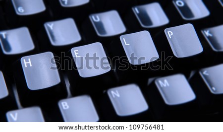 The word Help spelled out on a computer keyboard. Only the keys forming Help are in focus.