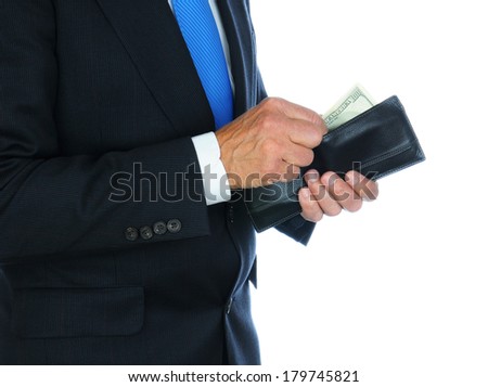Closeup of a businessman wearing a dark suit taking money from his wallet.  Horizontal format over a white background only showing the mans torso and hands.