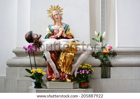 ST. GALLEN, SWITZERLAND - JULY 10, 2014: Jesus and Mary sculpture in the Abbey of Saint Gall. The Roman Catholic Cathedral in existance since 719 is has been a UNESCO World Heritage Site since 1983.