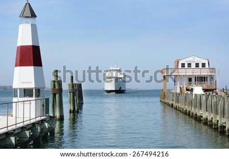 PORT JEFFERSON, NY - April 6, 2015: Auto Ferry arriving at port. The ferry \'Park City\' arrives at Port Jefferson, New York from Bridgeport Connecticut. The boat carries 95 vehicles and 1000 passengers
