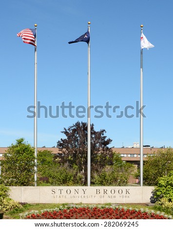 STONY BROOK, NY - MAY 24, 2015: Stony Brook University Main Entrance. The flags at the SUNY institution at Stony Brook, Long Island, New York.