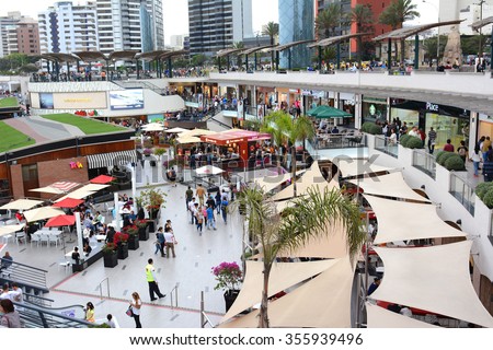 LIMA, PERU - OCTOBER 18, 2015:  Larcomar Mall in Miraflores, Peru. Shoppers in the outdoor mall that sits between the ocean and Alfredo Salazar Park.