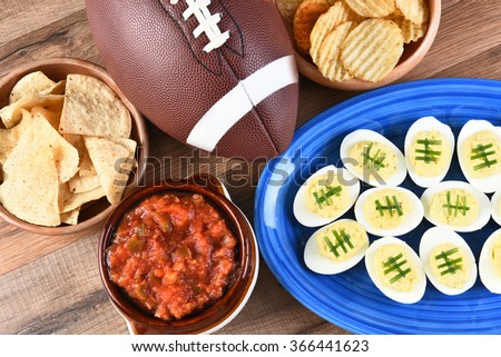 High angle view of snacks for watching a football game. Great for Super Bowl or Playoff themed projects.