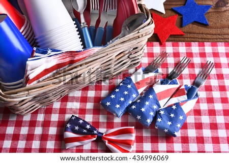 High angle view of a patriotic picnic table set for a 4th of July celebration. Horizontal format.