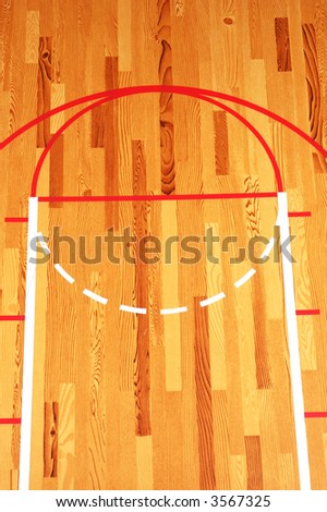 Basketball Key painted on hardwood floor in gymnasium
