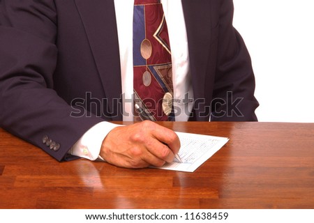 Businessman at Desk Filling out Forms isolated over white