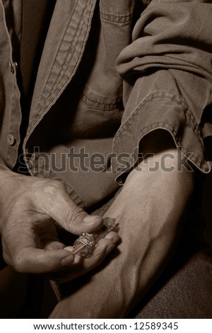 Man With Hypodermic Needle Giving Himself an Injection