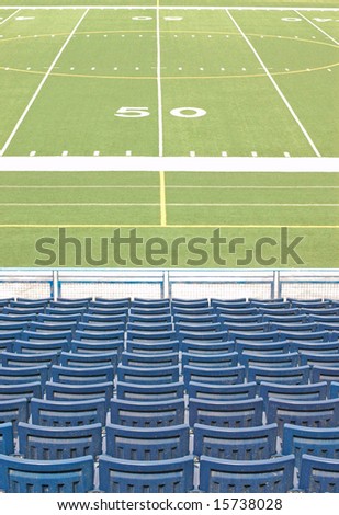 Football Stadium With Empty Seats Looking at 50 Yard Line Marker, no people