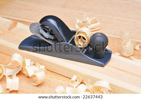 Small Block Plane and Wood on work bench with shavings