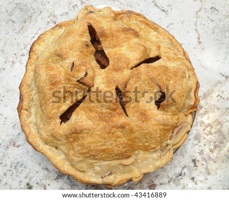 Freshly Baked Apple Pie Cooling on Granite Countertop - Square Format seen from high angle